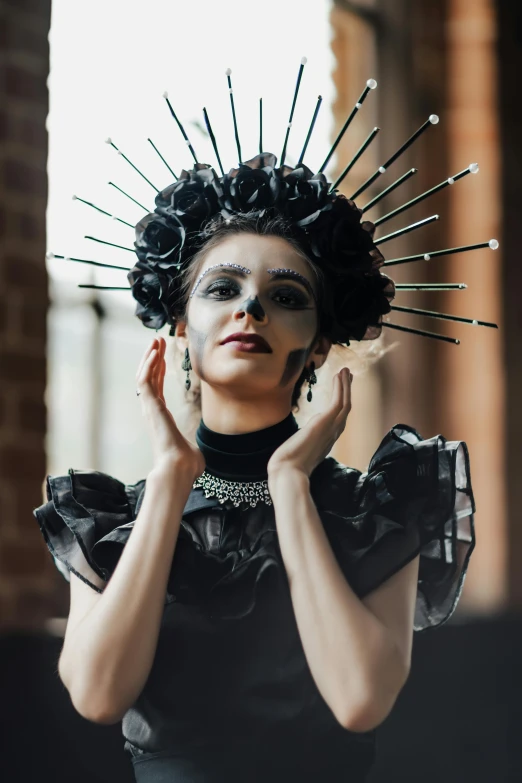 a woman with makeup painted like a spike headpiece