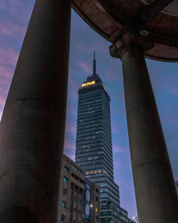 a building surrounded by tall buildings in the city