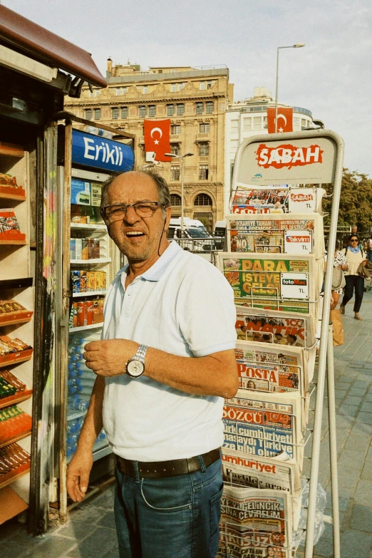 a man standing in front of a store filled with business items