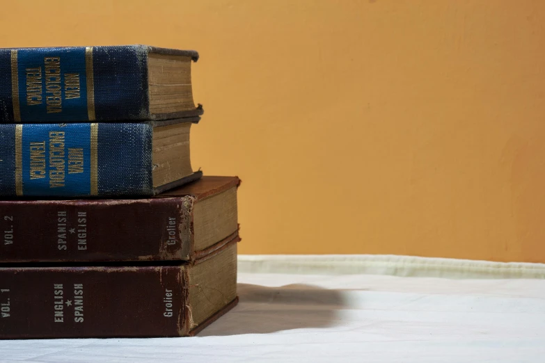 three books sitting on top of each other