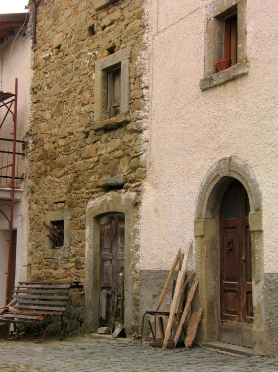 a small, rundown street with some very old door