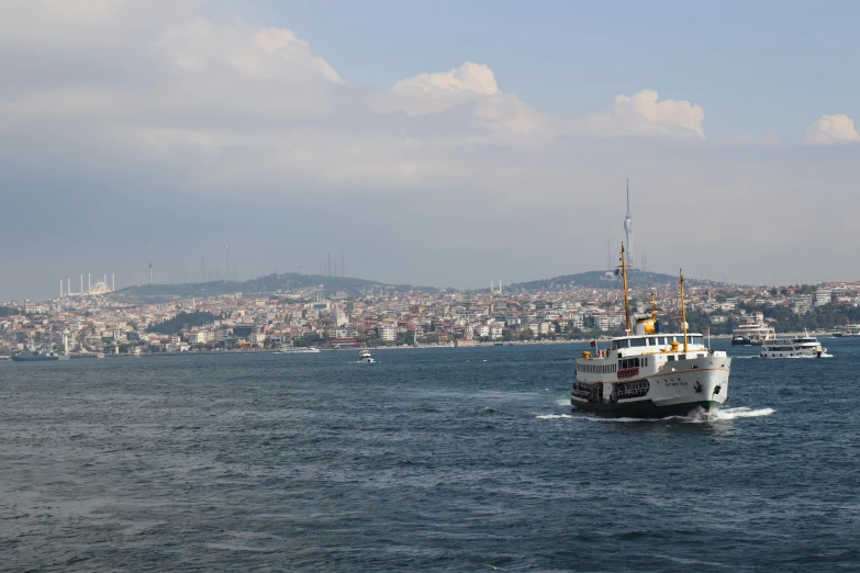 large boat traveling in large body of water