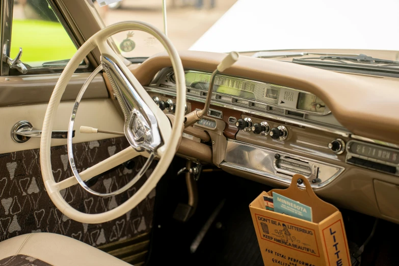 an old fashioned dashboard sits next to a paper sign