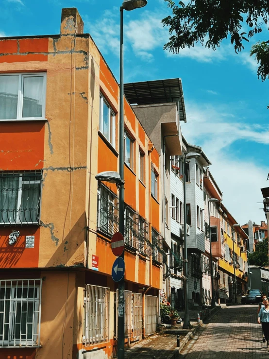 street with various colors on buildings in an urban area