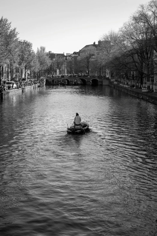 a person is in a boat down the river