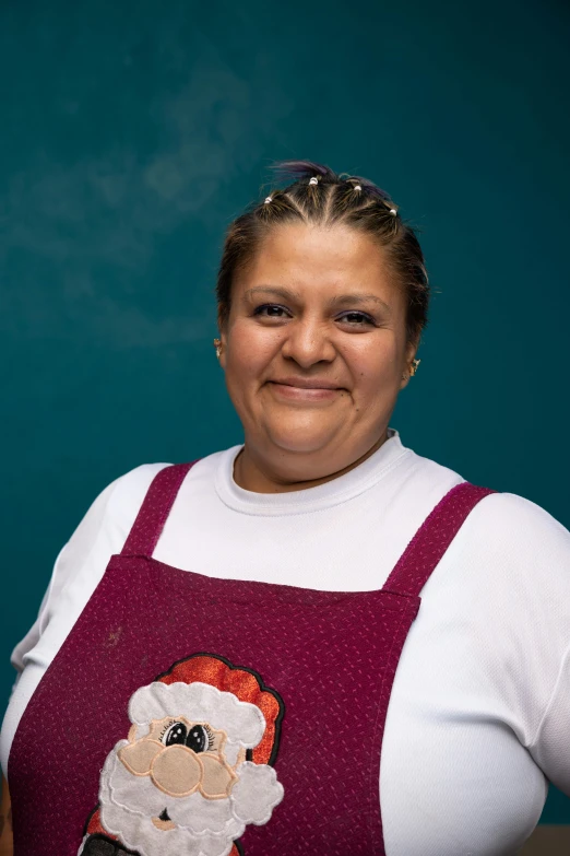 a woman with a santa clause knitted top