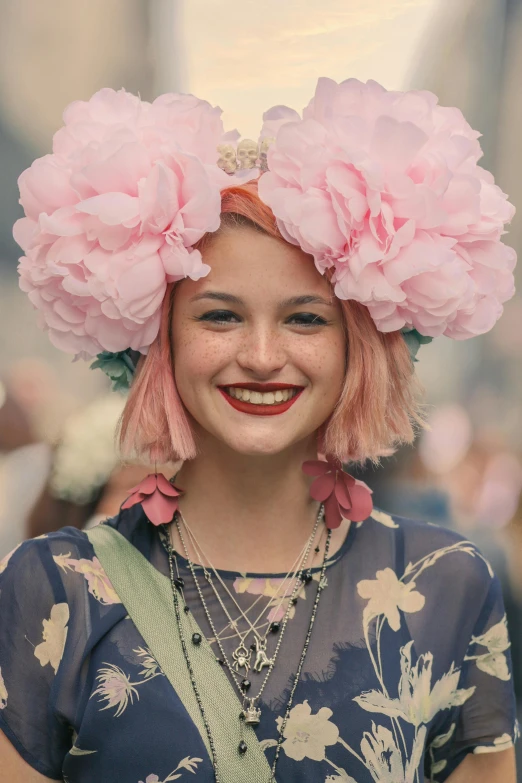 the pink flowers have been covering her head