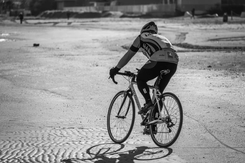 a man is riding a bicycle in a field