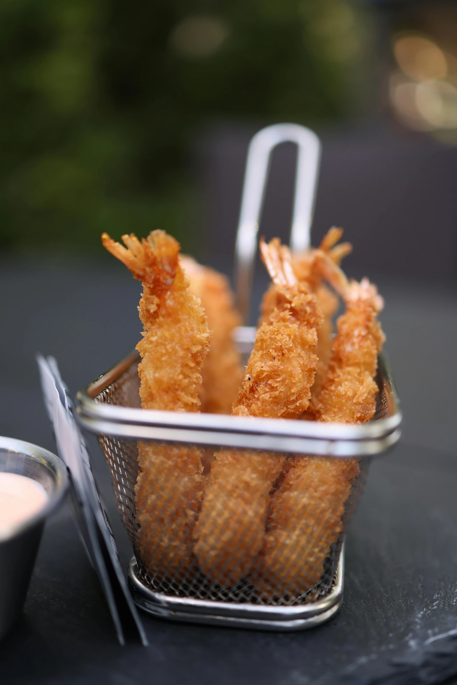 there are many fried food items in the basket