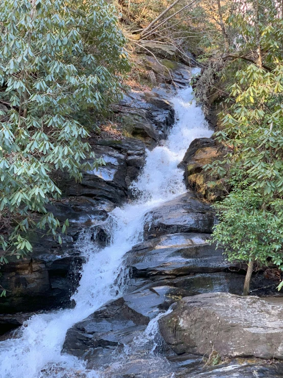 there is a water fall that goes down the side of the hill