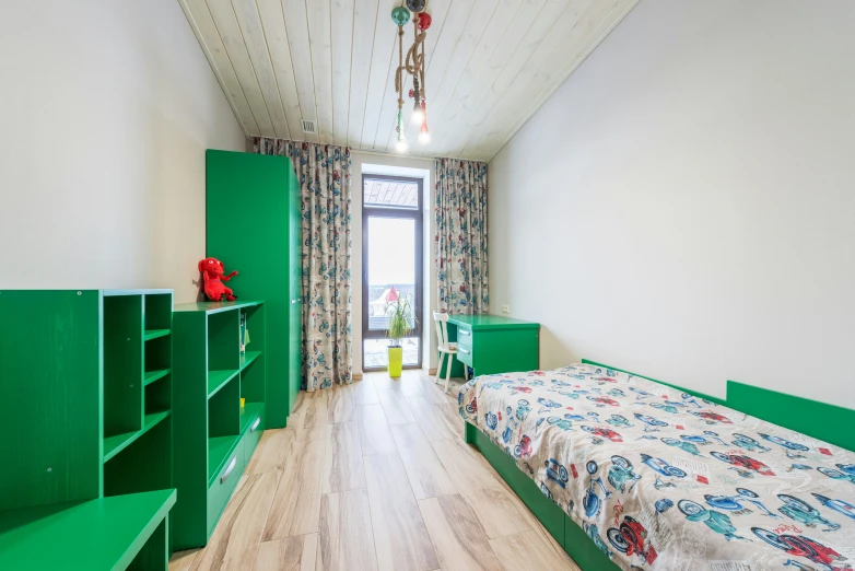 an empty and neat bedroom with green accents