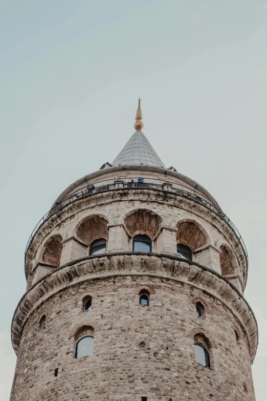 a tower with a clock on it made of brick