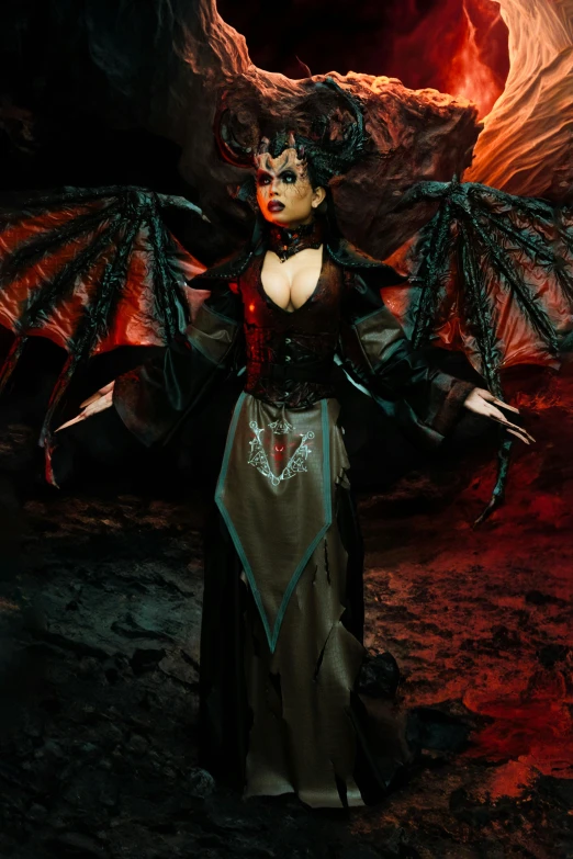 a woman in a black dress standing next to a large demon