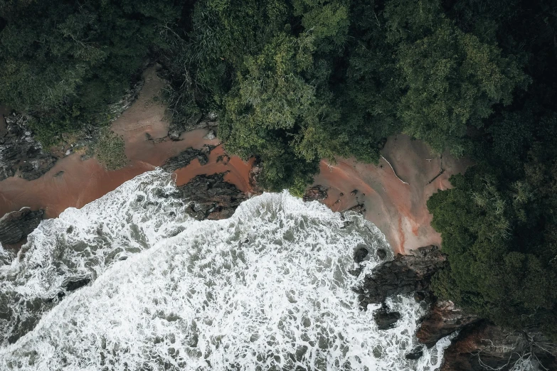 the overhead s shows a large body of water surrounded by trees