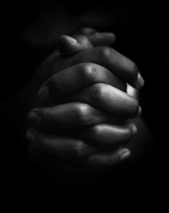 a woman's hands with their hands wrapped around them