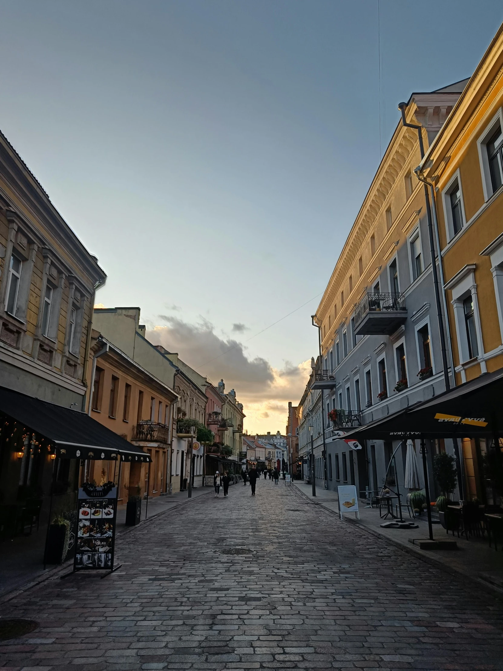 the old streets are empty, with the shops and restaurants on either side