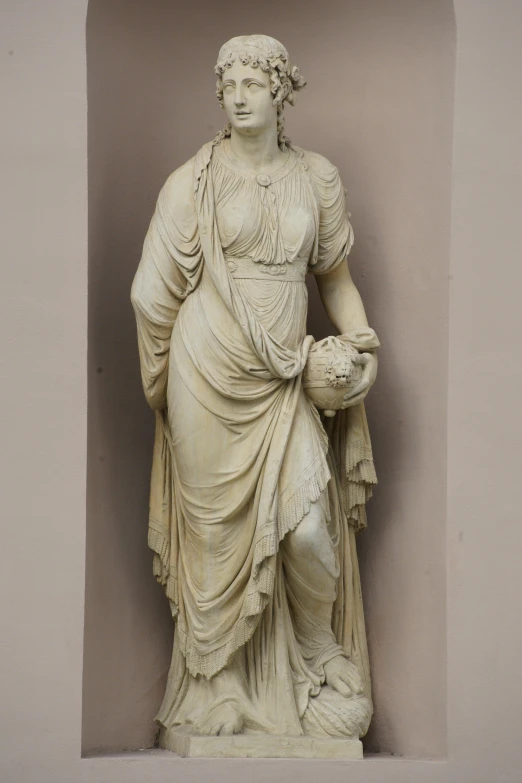 a statue of a female character holding a basketball