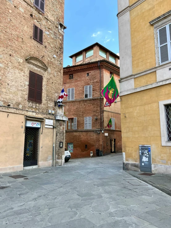 an empty street next to some large buildings