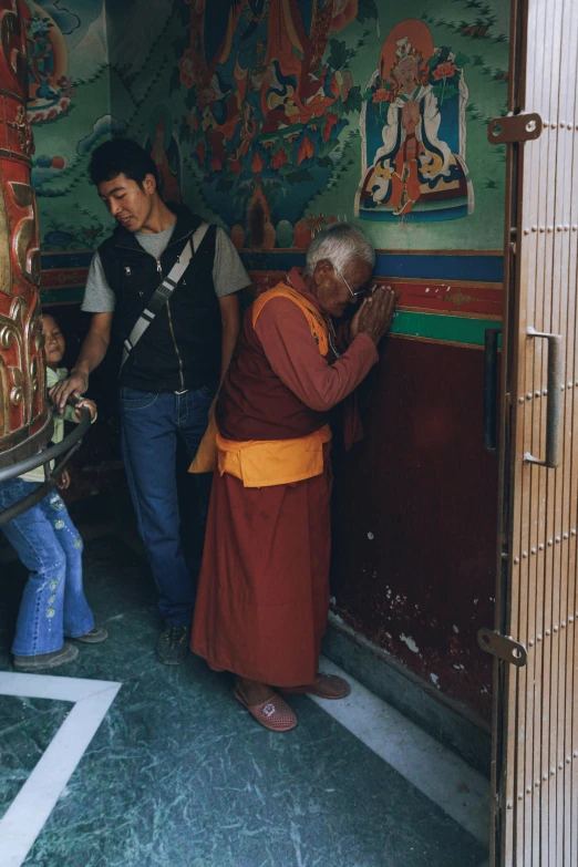 there is a monk talking to a man