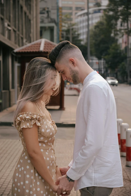 an image of a man and woman holding hands