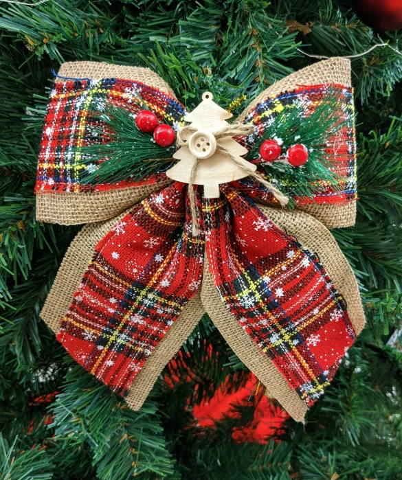 a wreath on the christmas tree with christmas decorations