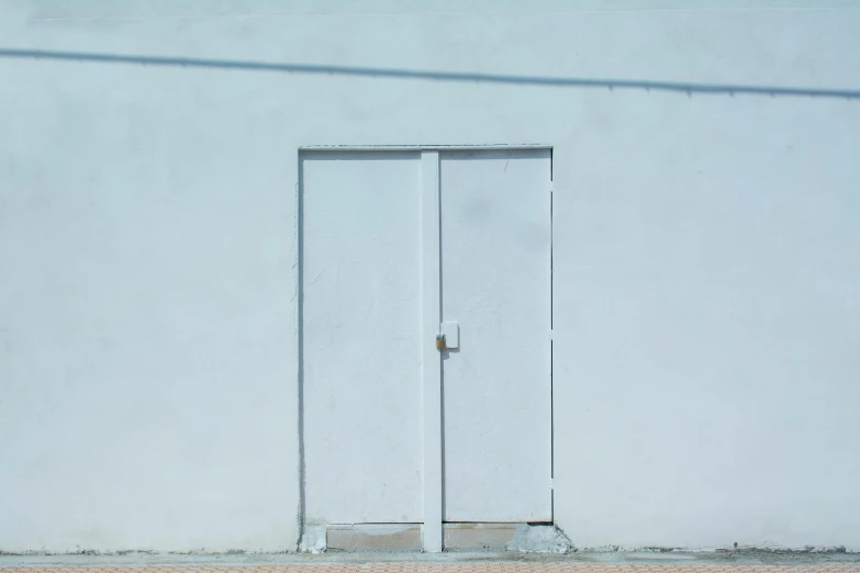 a white door on a white wall