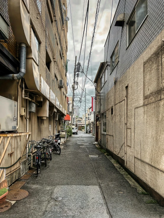 several bicycles parked along the back side of the building