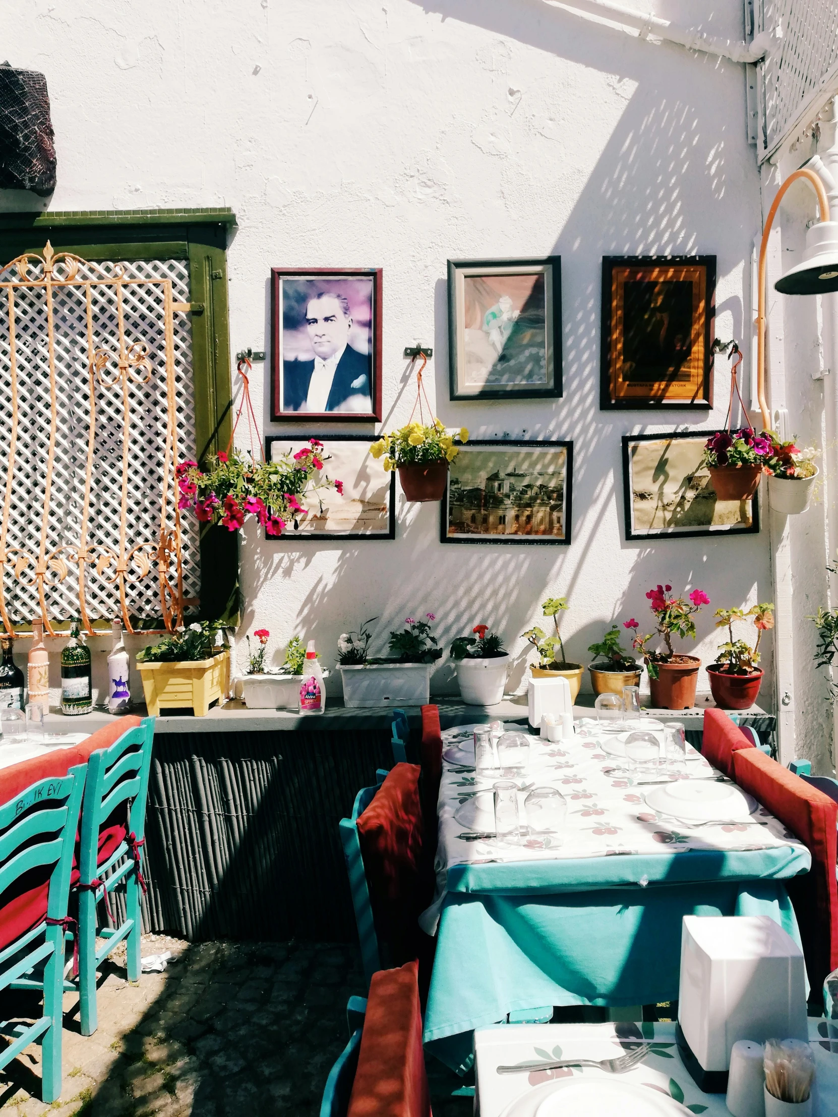 a dining room with bright blue tables and red chairs