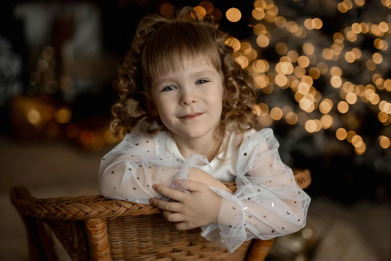 a little girl in white shirt standing on wooden chair