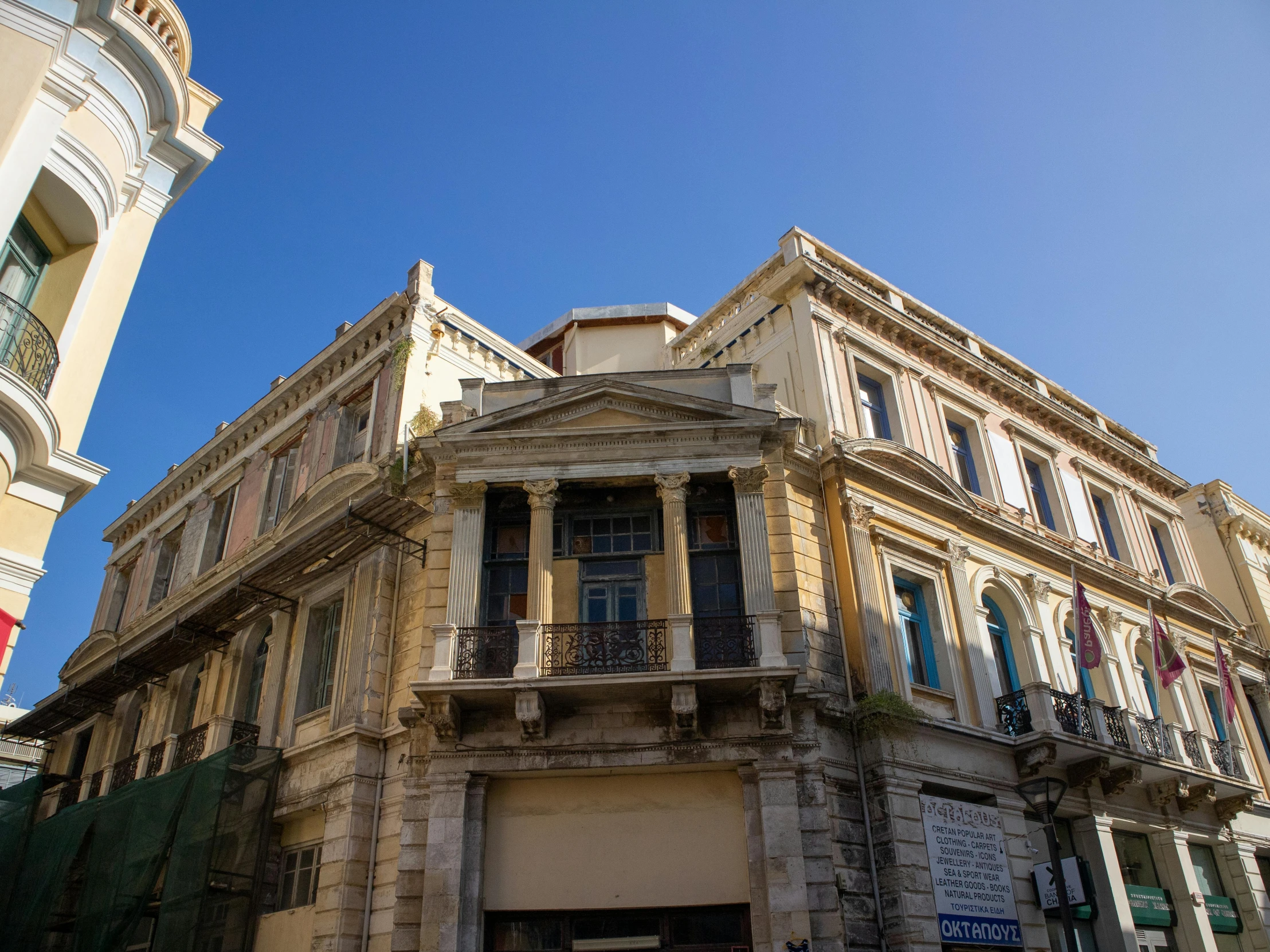 old buildings in front of a building with balcony