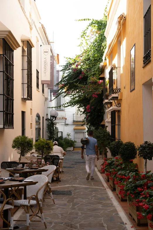 a small courtyard with tables and chairs