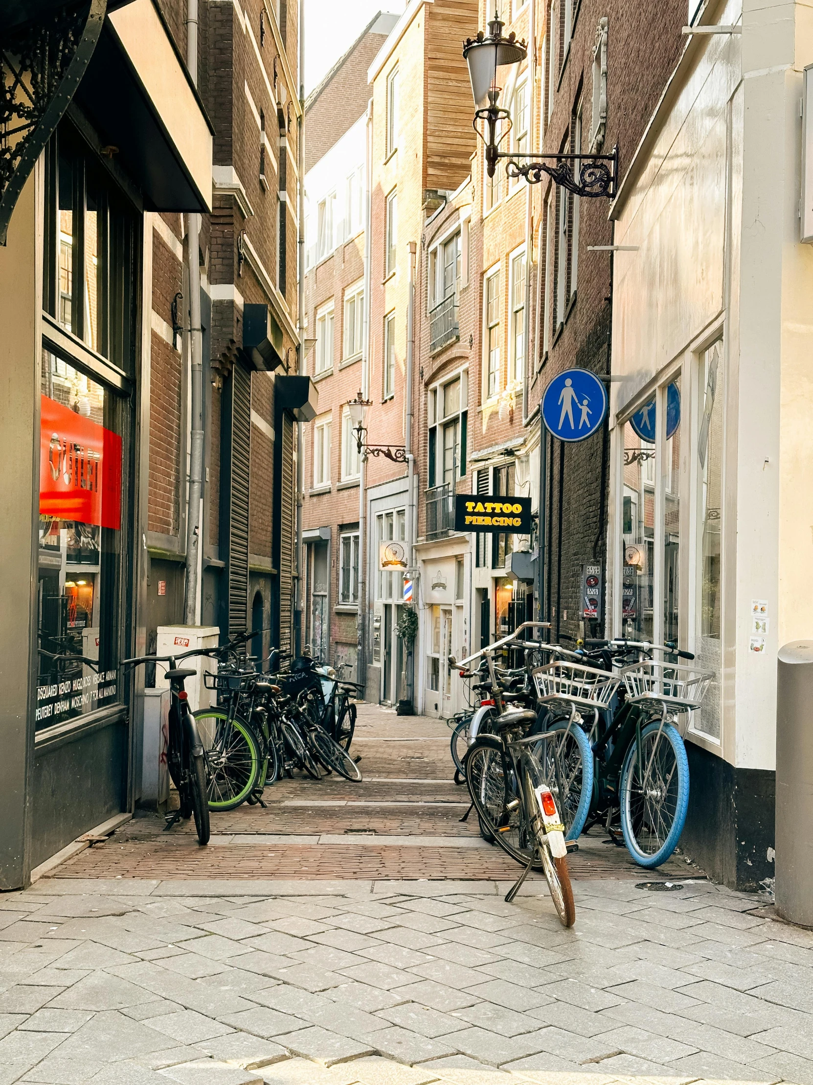 a city street with bikes parked next to some stores