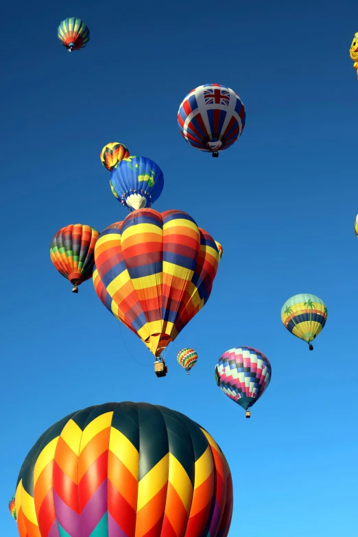 various balloons in the air in a sunny day