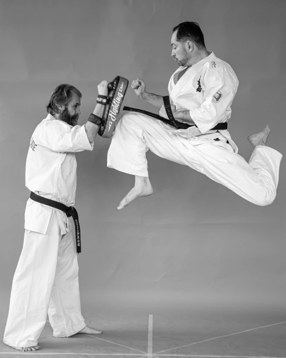 an athlete and an opponent performing tricks in the air