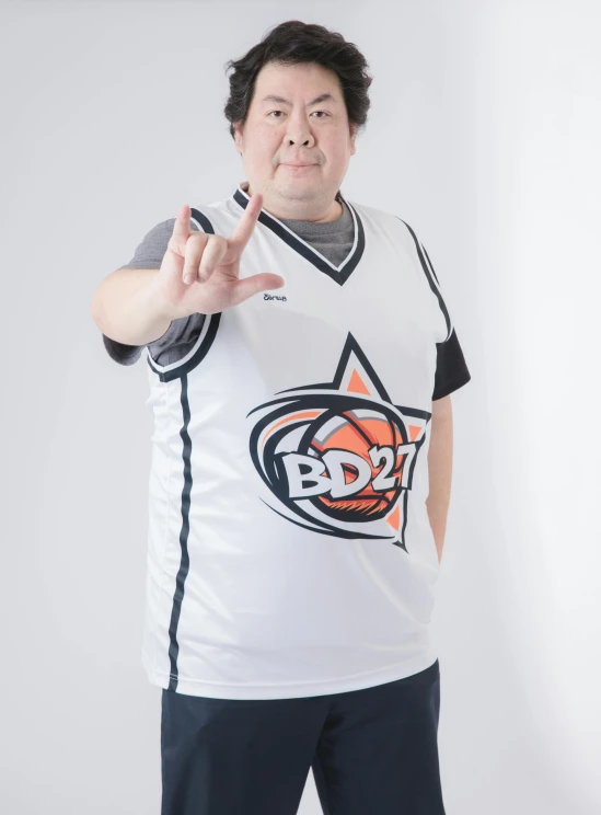 man in white basketball jersey doing an okay hand gesture