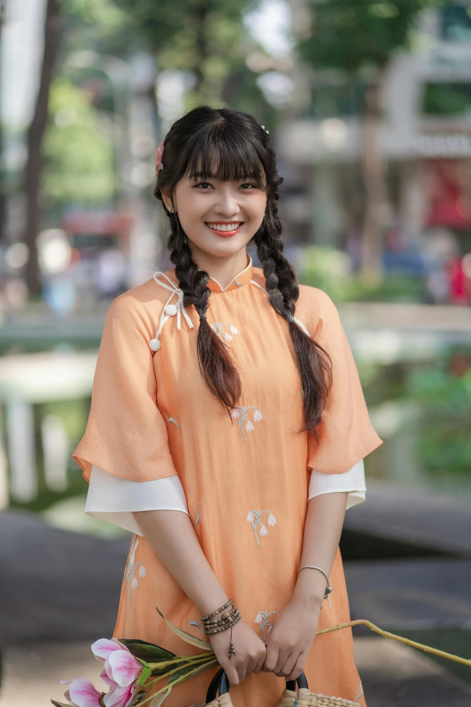 an asian woman holding a basket smiling for the camera