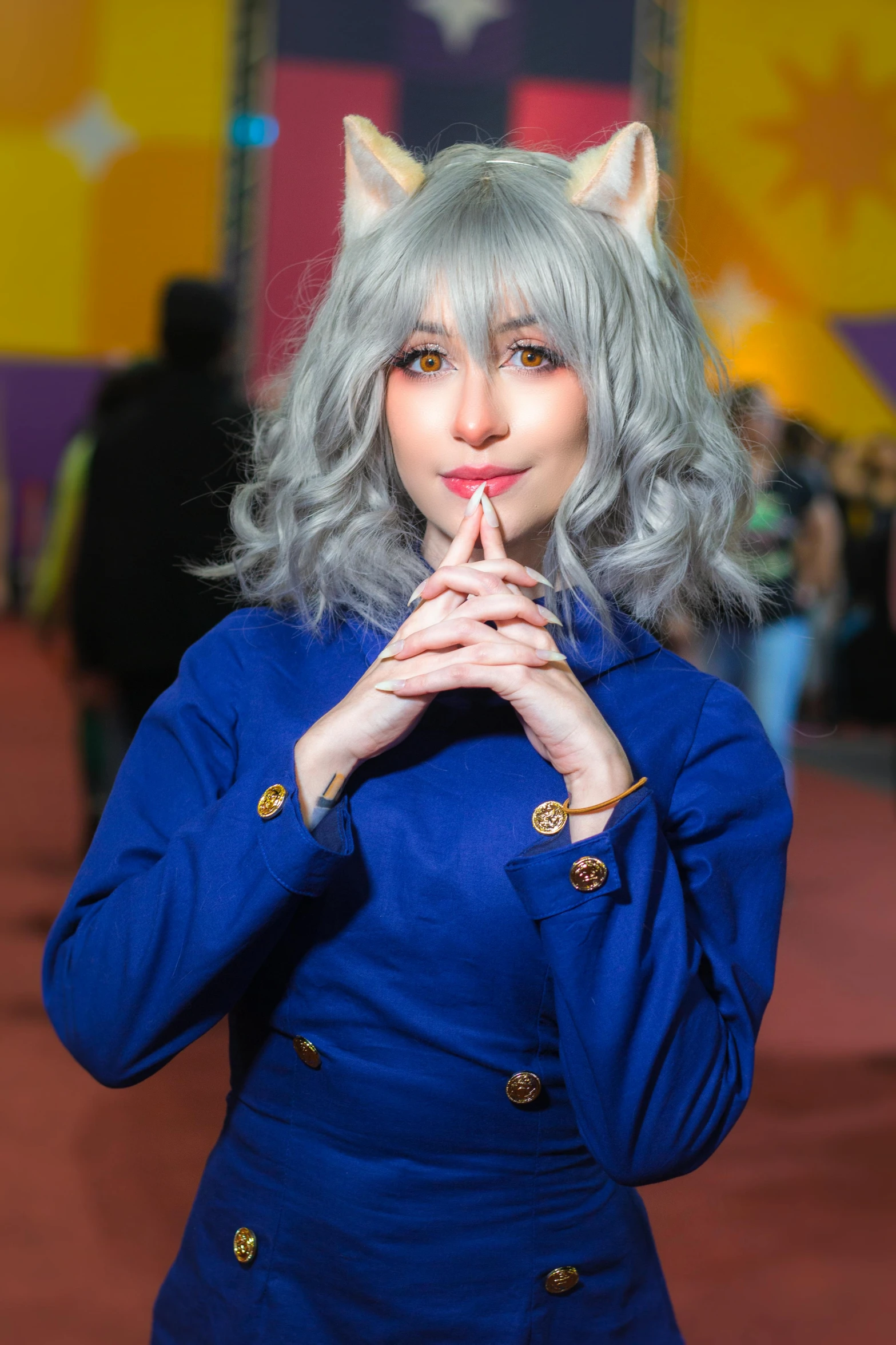 woman with light grey cat ears and dress poses for camera