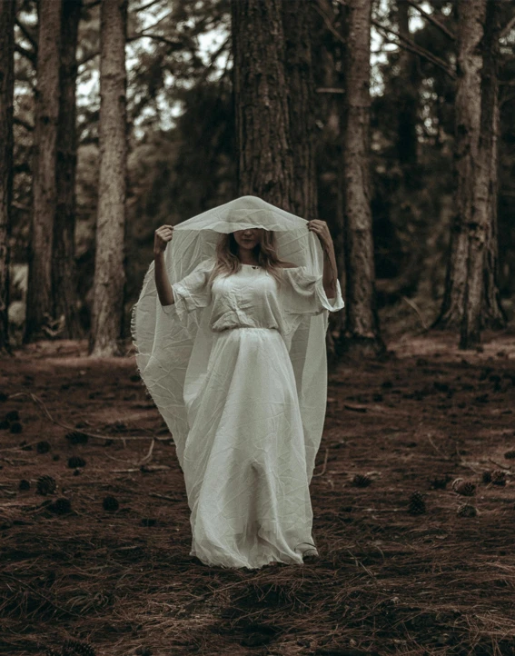 an image of a woman standing in the forest