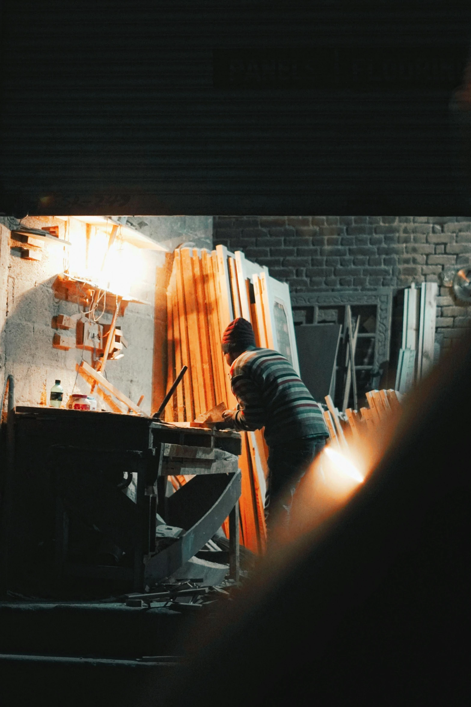 a person working in a large workshop area