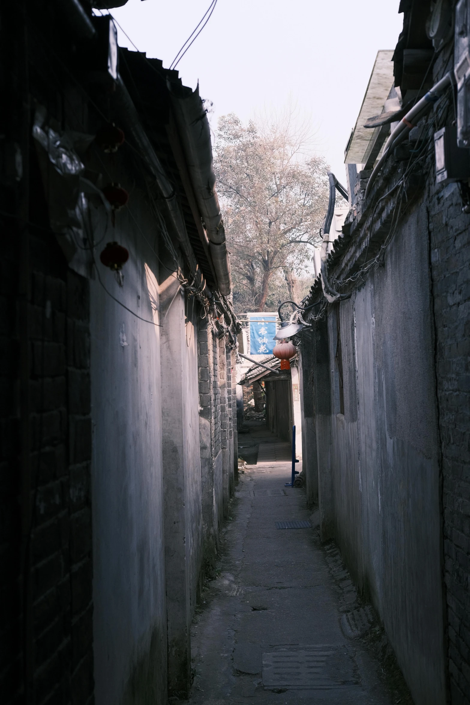 an alley way is in between two stone buildings