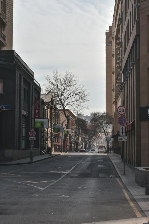 the empty street next to the building is very narrow