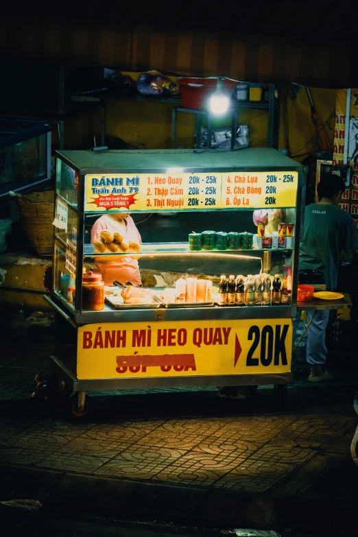 a food stand on the street at night