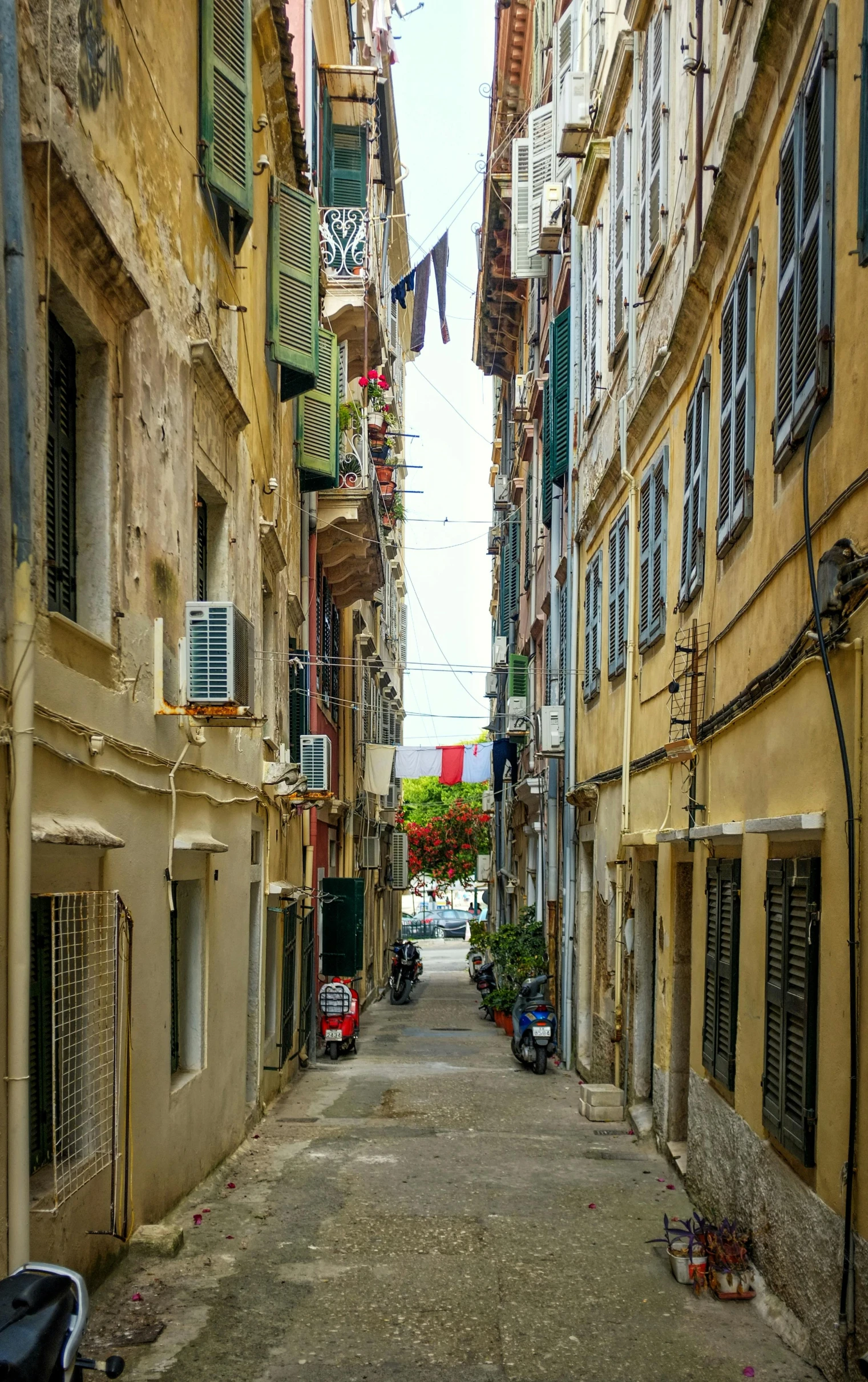 a view down a narrow street lined with balconies