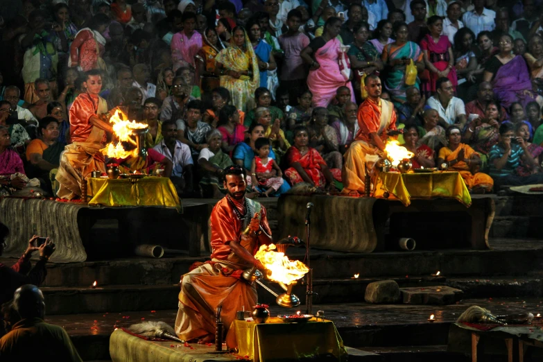 an image of people doing soing with fire in the air