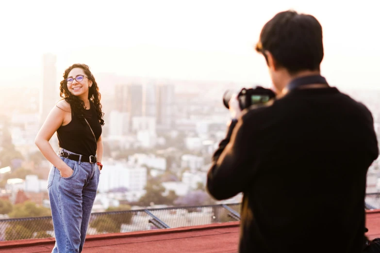 a woman that is standing up with her camera