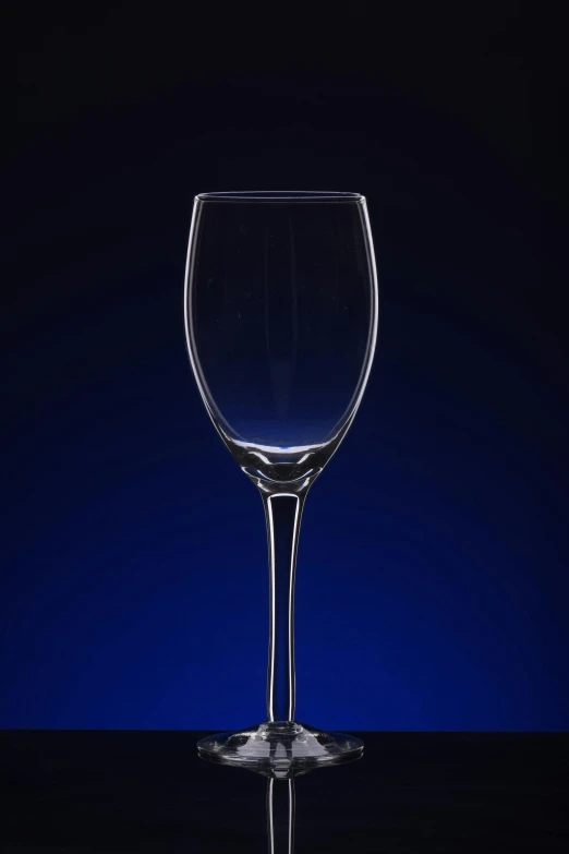 the view of a wine glass is shown in front of a blue background