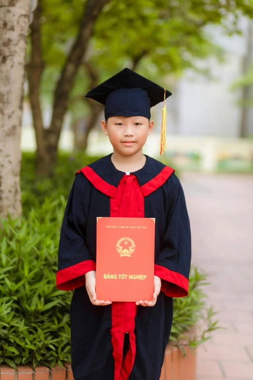 the  is holding up a congratulations card