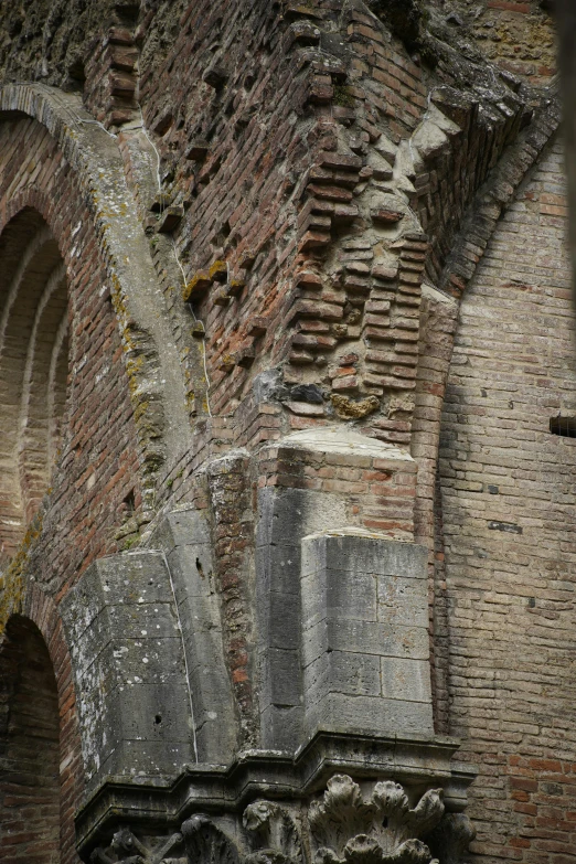 an old brick building with a circular window