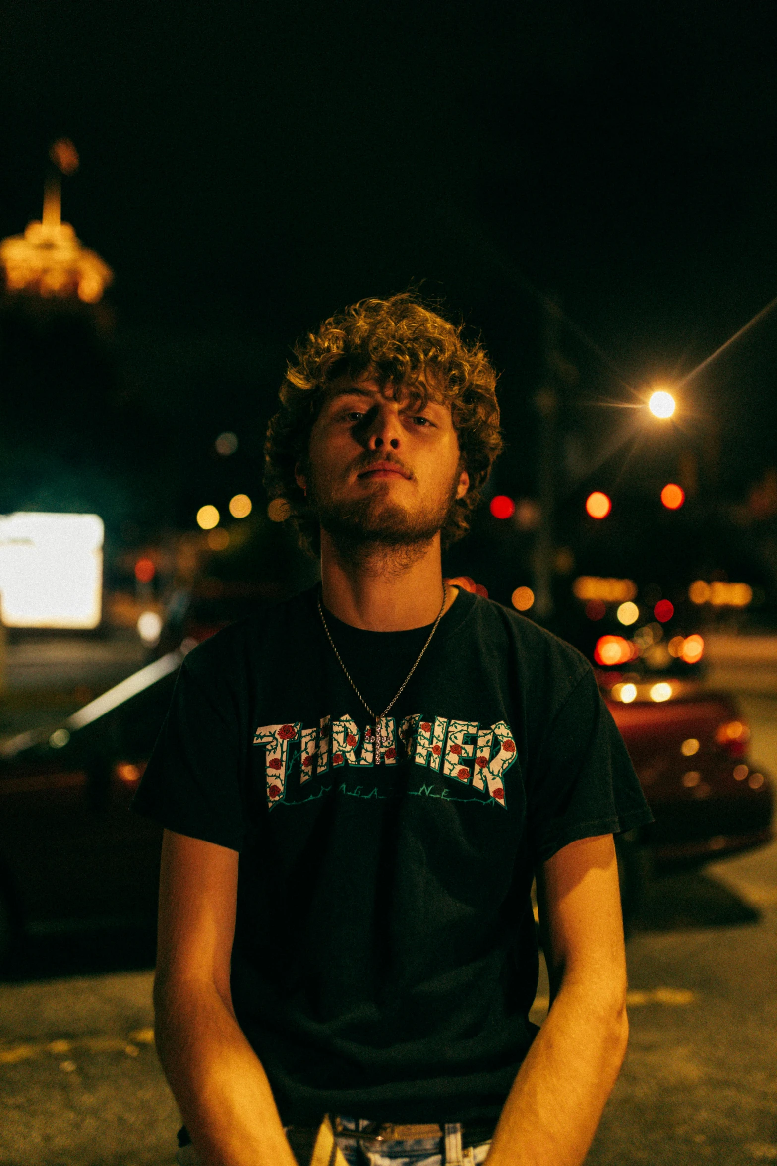 a man is standing outside by a street