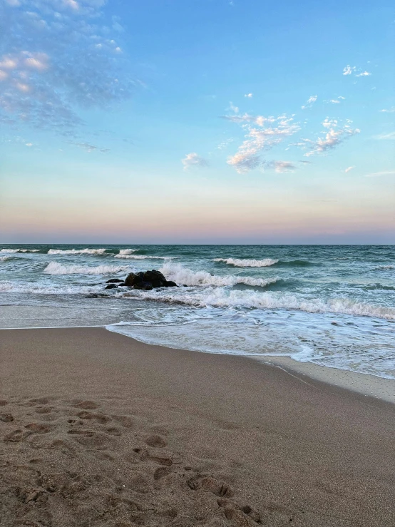 the beach is covered in water and waves